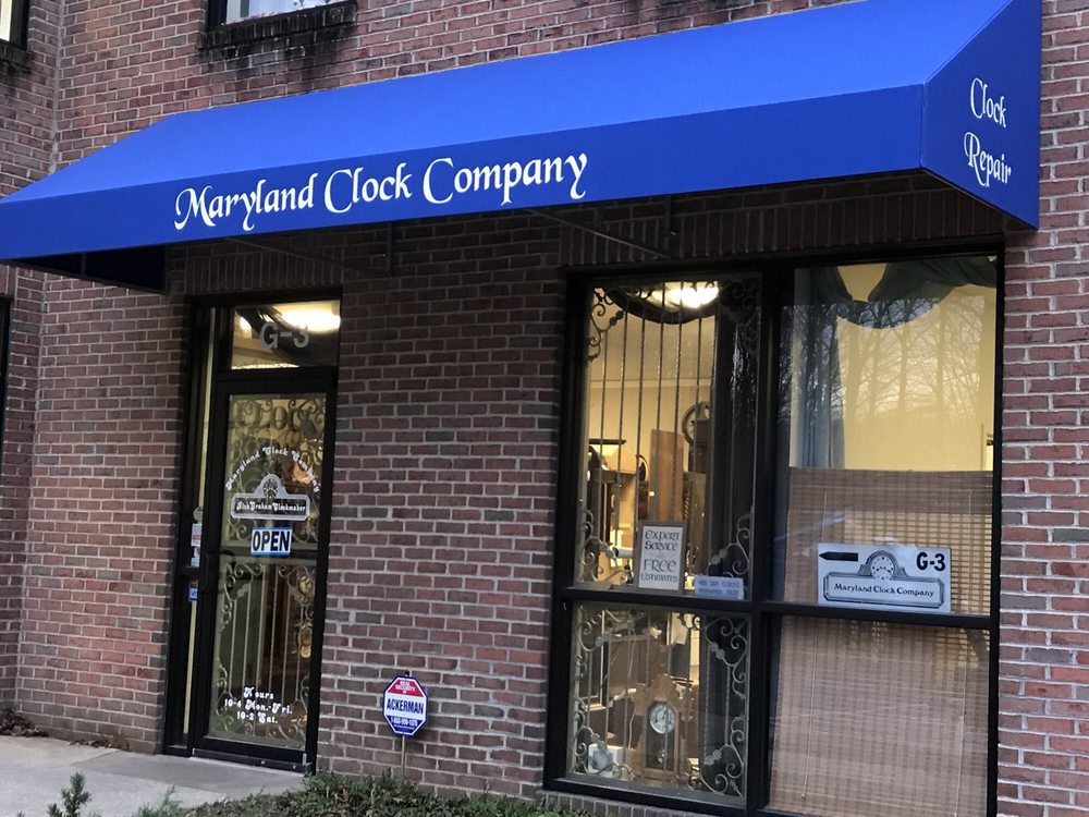 Clock shop with blue awning