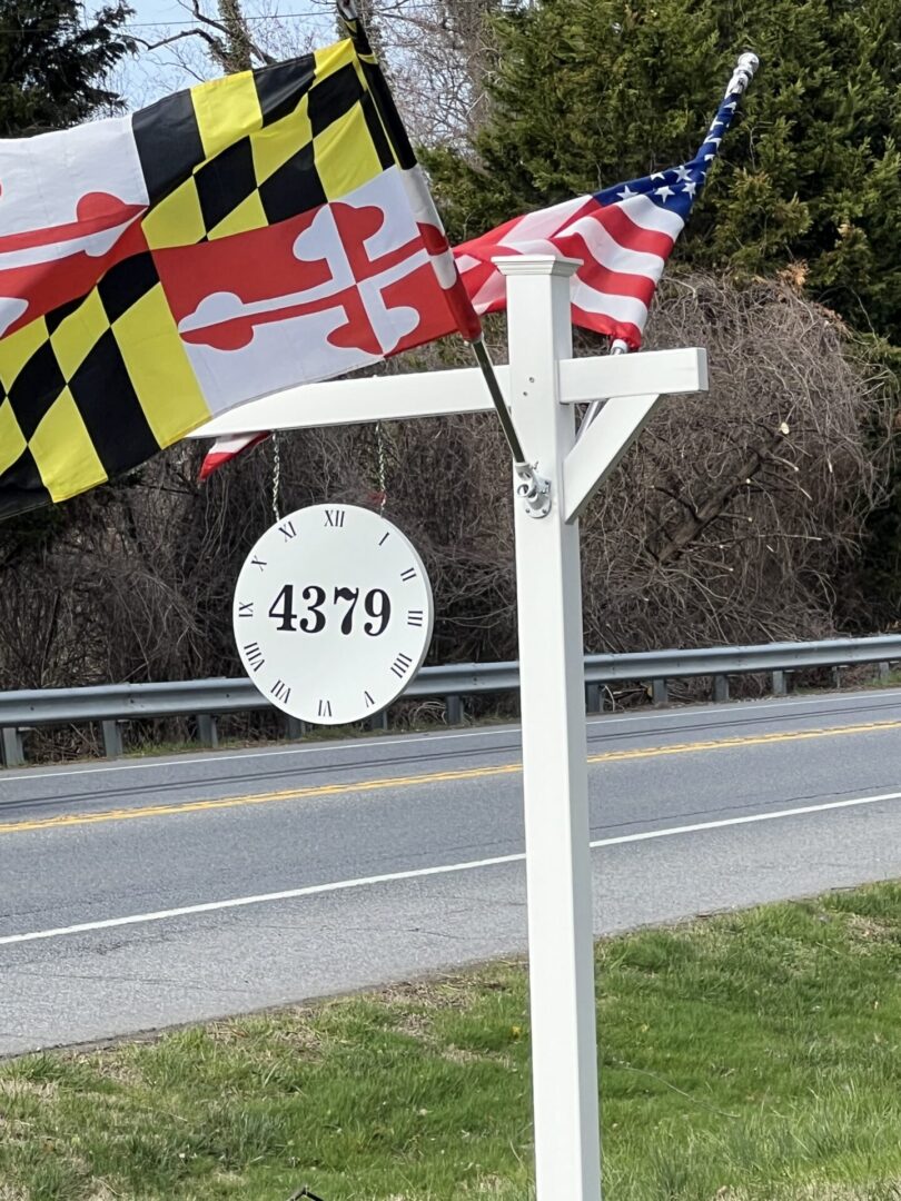 House sign 4379 with Maryland and American flags